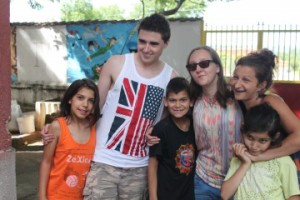 Students Chris Williams and Xenia Bibicoff-Crowley with children and staff from the orphanage.
