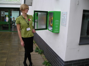 The Locks Hill Surgery defibrillator being accepted by Tracy Mitchell