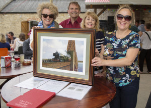 Pippa Goldfinger, Keith and Eileen Falconer and Sue Bucklow with a painting of the Forth Bridge 