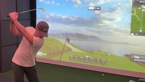 Golf simulator swings into action