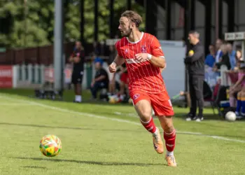 Narrow win boosts Town’s title hopes