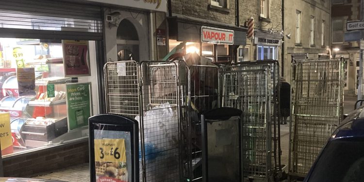 Resident calls for action over convenience store rubbish littering street