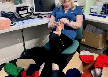 Frome optician team member knits hats for homeless charity