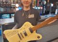 Cheese and Grain raffles signed Coldplay guitar for young musicians